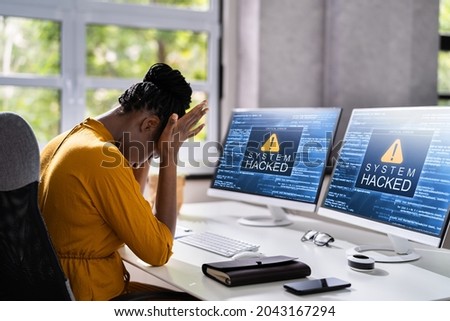Computer System Hacked. Virus Software Screen On Monitor Royalty-Free Stock Photo #2043167294