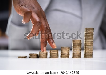 African American Woman Loan Savings And Rich Business Investor Royalty-Free Stock Photo #2043167345