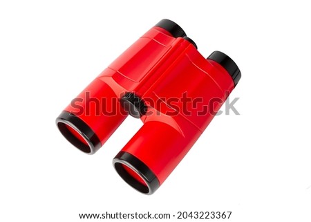 Red binoculars. Children's toy. Binoculars Isolated On White Background. Royalty-Free Stock Photo #2043223367