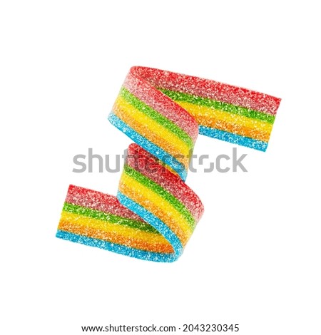 Rainbow sour jelly candy strip in sugar sprinkles isolated over white background. Top view Royalty-Free Stock Photo #2043230345