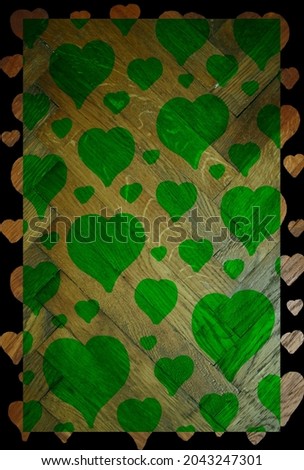 Green wooden background with hearts.