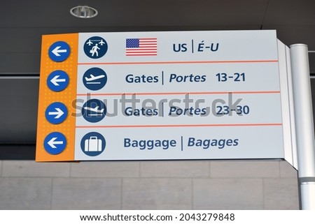 Generic wayfinding signage for gates and luggage or baggage claim at airport.