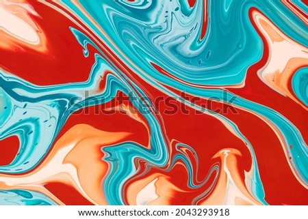 Fluid art background with colorful swirls and blending dyes that flows from top to bottom. Liquid artwork with overflowing and paint mixing effect. Acrylic texture with bright blended colors.