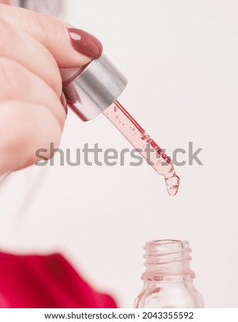 Cosmetic serum in a pipette close-up