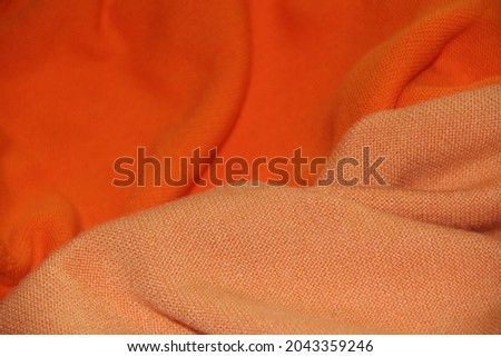Various orange woolen fabric. Backgrounds