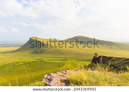 Summer landscape of the Sunduki mountain range located in the valley of the Bely Iyus River in Khakassia, Russia. Mountain view the Third Sunduk