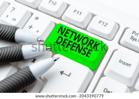 Hand writing sign Network Defense. Business overview easures to protect and defend information from disruption Typing Difficult Program Codes, Writing New Educational Book