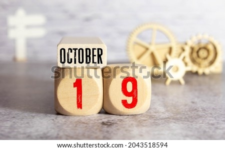 October 19th. Day 19 of month. Calendar cube on modern pink background, concept of bussines and an importent event