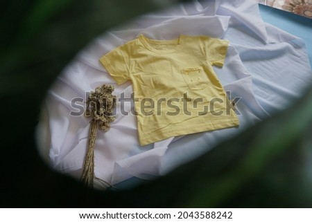 Photos of cute clothes for children under ten years with a white cloth background