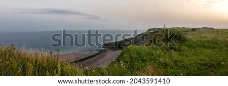 magnificent panoramic landscape photograph of the Opal Coast (Farance) - photograph taken at Cap d'Alprech at sunrise showing the hiking trails, the beach and the sea in a calm and serene atmosphere