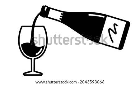 Wine bottle and glass. Pouring wine into a glass.