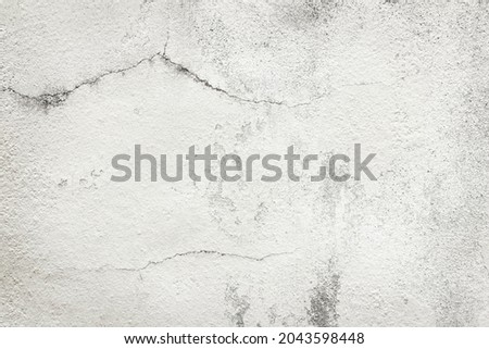 White grey old wall texture with cracked and peeled in vintage style for background and design art work.