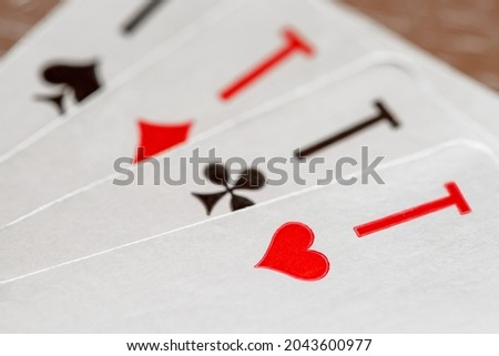 Playing cards, aces of hearts, clubs, diamonds, spades, macro close-up, selective focus