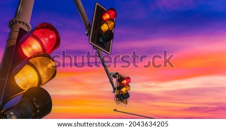 Traffic lights over urban intersection.