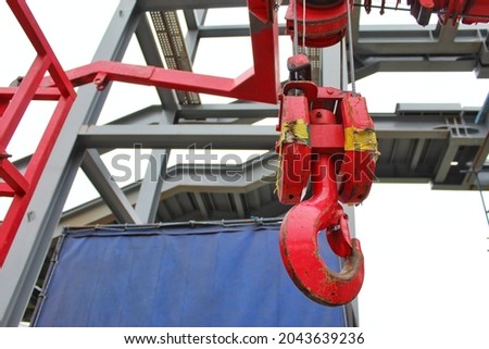 red crane hook  Used for lifting heavy objects.  for construction