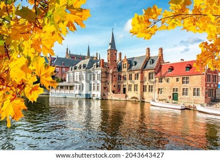 Bruges canals and medieval architecture in autumn, Belgium Royalty-Free Stock Photo #2043643427