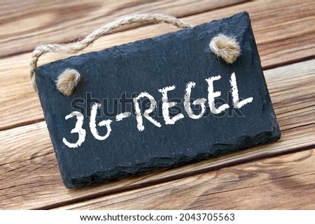 3G-Rule and board on wooden background Royalty-Free Stock Photo #2043705563