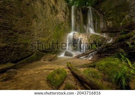 A hidden waterfall in fairytale forest