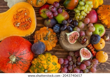 Autumn composition, Thanksgiving or Halloween concept, a lot of food, fruits, pumpkins, harvest. Flat lay, top view