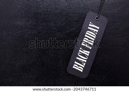Label with the words Black Friday on a black background.