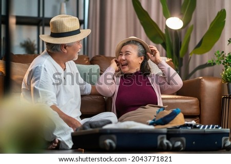 lovely happiness old senior marry retired couple prepare luggage suitcase arranging after covid lockdown is over time to travel abroad again,asian couple organize cloth suitcase travel concept Royalty-Free Stock Photo #2043771821