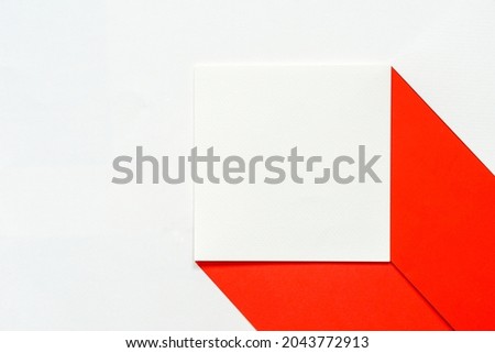  blank clean white square brochure on red paper against white paper background, identity mock up card concept.
