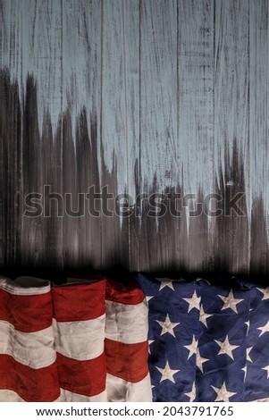 Close up of waving national usa american flag on wooden background with copy space for text.