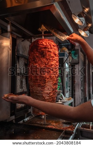 Mexican taquero working doing tacos 