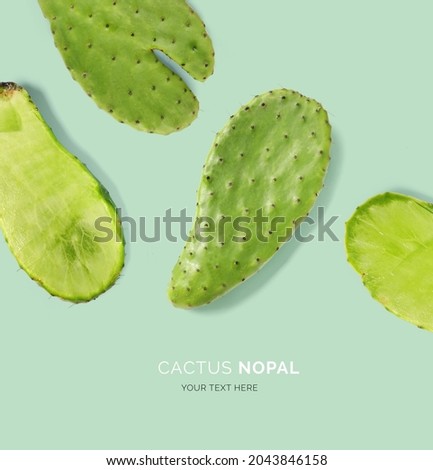 Creative layout made of cactus nopal on the green background. Flat lay. Food concept.