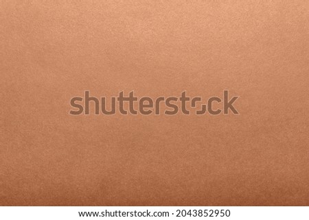 Texture backdrop photo of brown colored paper surface.