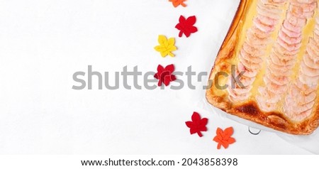 Web banner with apple pie with custard cream on the puff pastry on white. Autumn dessert. Template with copy space