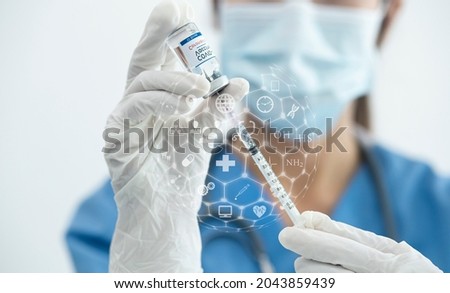 Doctor hands holding vaccine jar COVID-19, Making a vaccine injection, Medicine digital healthcare and connection on modern virtual screen. 