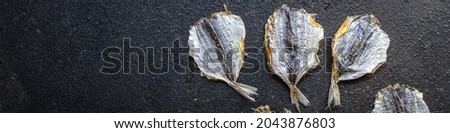 salted fish small dried sun-dried or smoked snack meal on the table copy space food background keto or paleo diet vegetarian food pescetarian diet