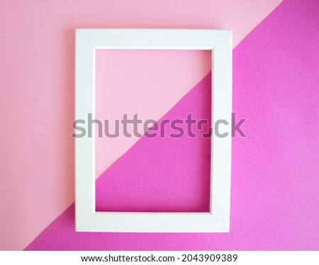 White frame on pink background, top view, space for text and message