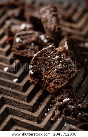 pieces of cake and chocolate on a wooden board. High quality photo