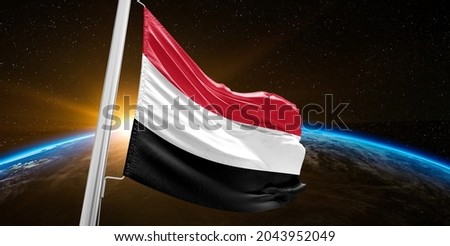 Yemen national flag cloth fabric waving on beautiful sky.