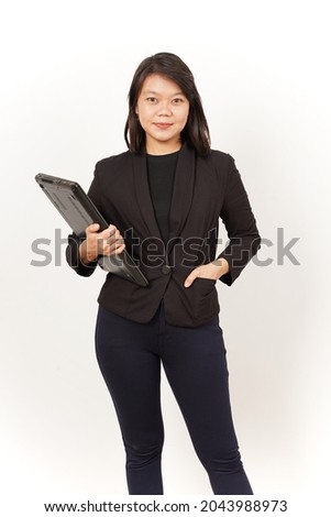 Beautiful Asian Woman Wearing black suit Holding laptop Isolated on white background