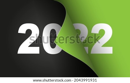 Happy New Year 2022 winter holiday greeting card design template. End of 2021 and beginning of 2022. The concept of the beginning of the New Year. The calendar page turns over and the new year begins. Royalty-Free Stock Photo #2043991931