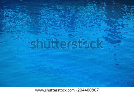 Blue water in swimming pool