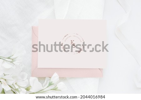 Botanical wedding invitation card with flower aerial view