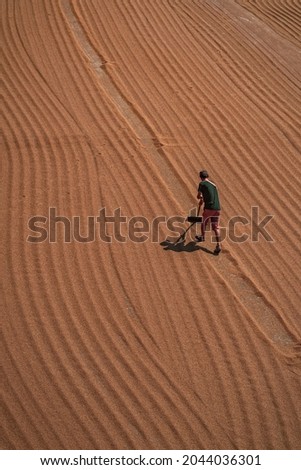 farmer working on field aerial shot. 
wheat farmer aerial photo.