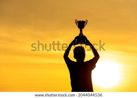 Winner win hands holding golden champion trophy cup prize. Silhouette best award victory hands trophy professional champion challenge team holding gold sport trophy cup. Win-Win sport team concept