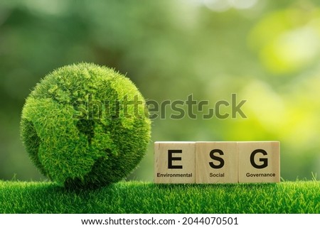 ESG concept of environmental, social and governance.words ESG on a woodblock It is an idea for sustainable organizational development. ​account the environment, society and corporate governance Royalty-Free Stock Photo #2044070501