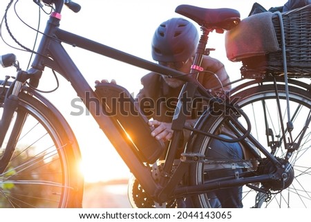 biker inserting electric bike battery