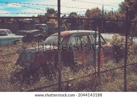 Old classic russian car near road. Photo in old image style.