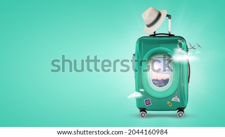 Travel the world, Suitcase with an airplane window. Travel and tourism aqua green background. Royalty-Free Stock Photo #2044160984