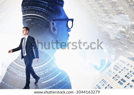 Two businessmen wearing formal suits are working together. Digital interface with circle hologram and padlock in the foreground. City skyscraper in the background. Concept of teamwork