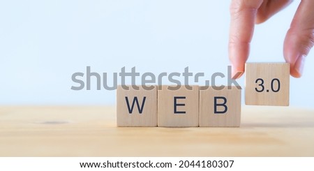 Web development, the next generation of internet, Web 3.0 concept. Futuristic technology for  better of human life.  Painted black word Web 3.0 on wooden cubes with beautiful white background. Banner. Royalty-Free Stock Photo #2044180307
