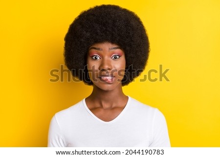 Photo of nervous worried dark skin woman bite lip problem trouble isolated on yellow color background