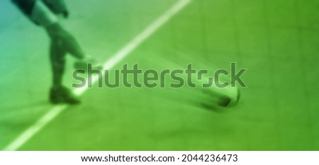 blur image of football player kick the ball